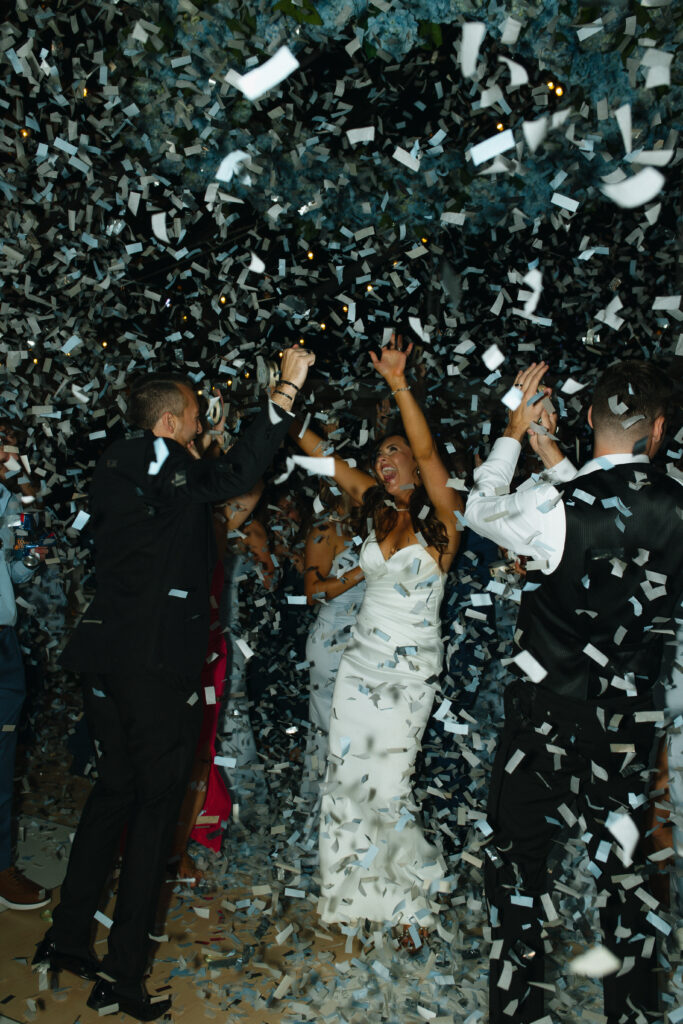 end of the night reception confetti popping all over in the air.