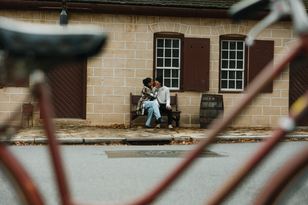 photo from across the street snuggling up on a bench