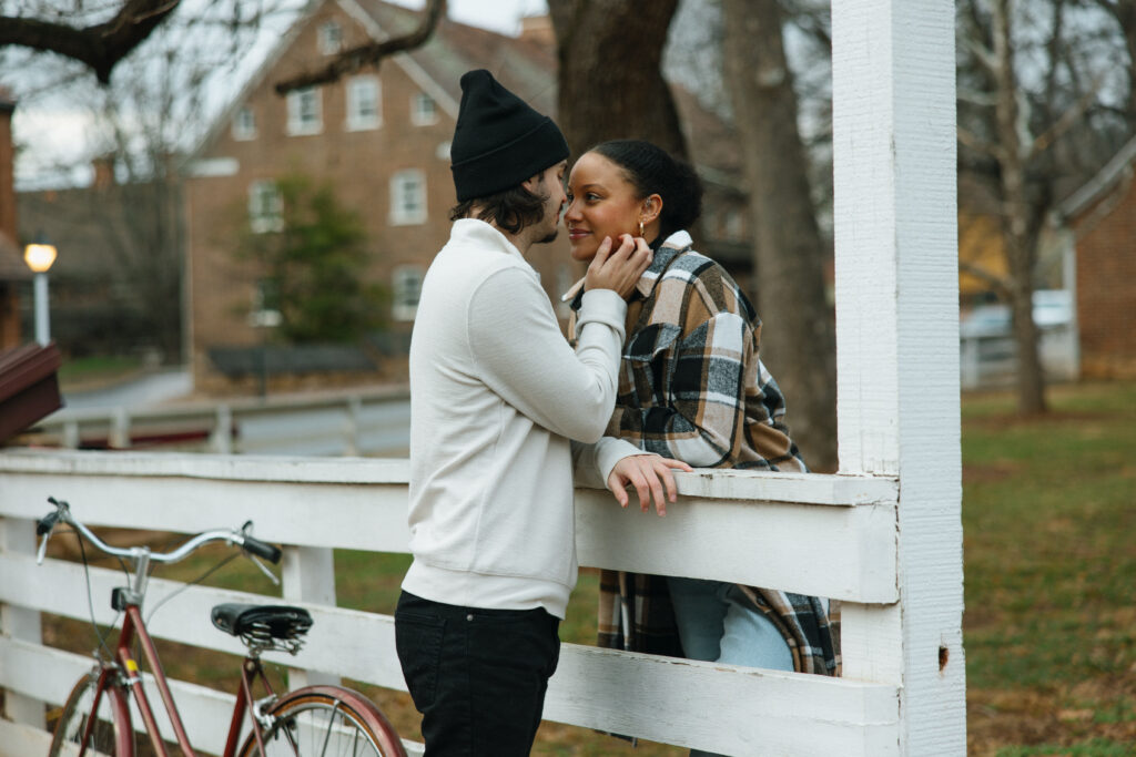 couple nose to nose smiling at each other 